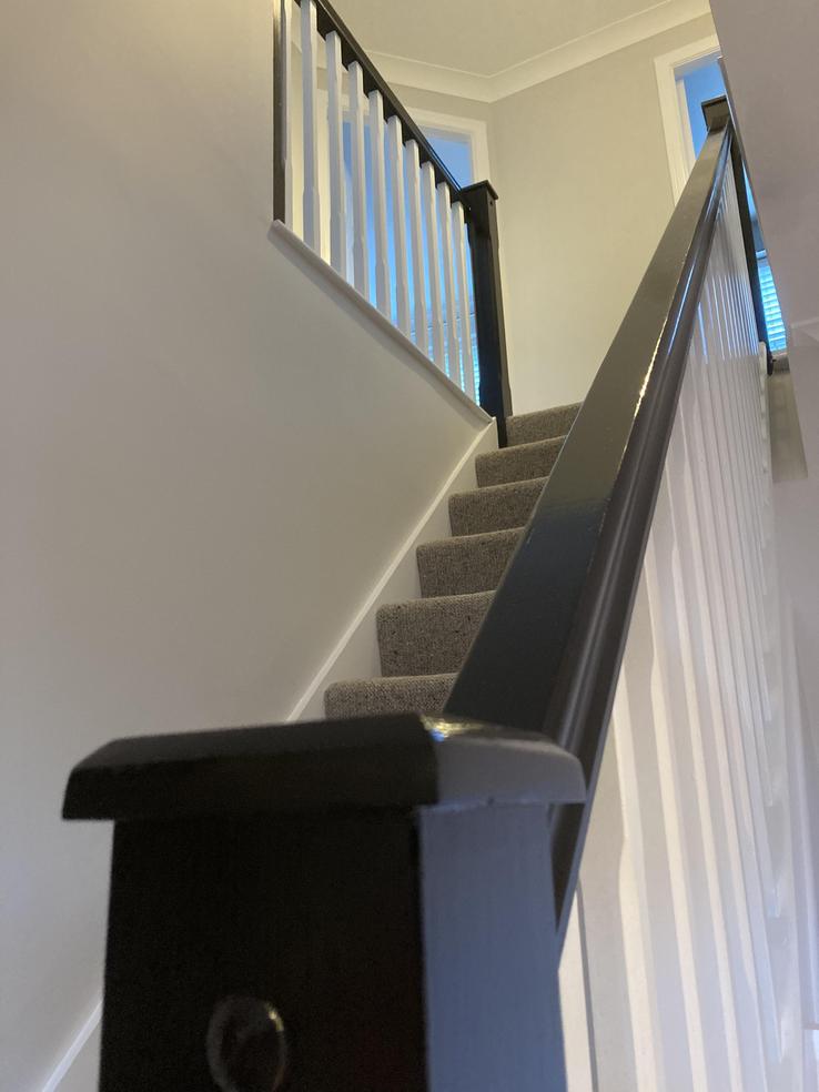 painted black matt null post with white spindles